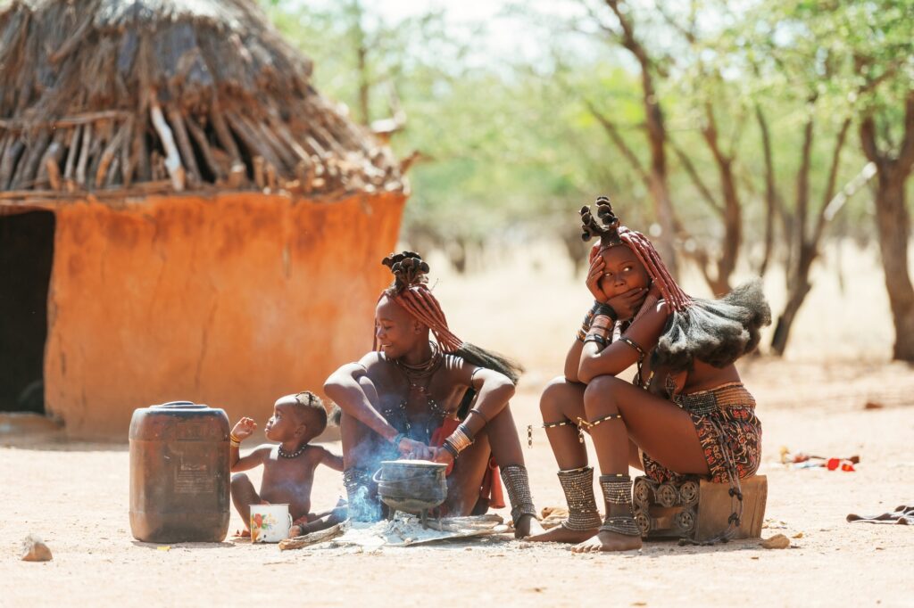 Namibia, Africa - June 14, 2021: Ethnic people, women are together near old styled home